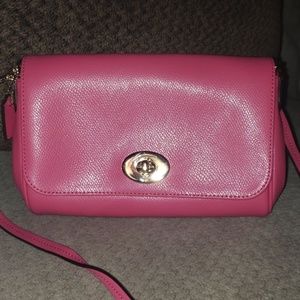 Coach crossbody pink small clutch purse.